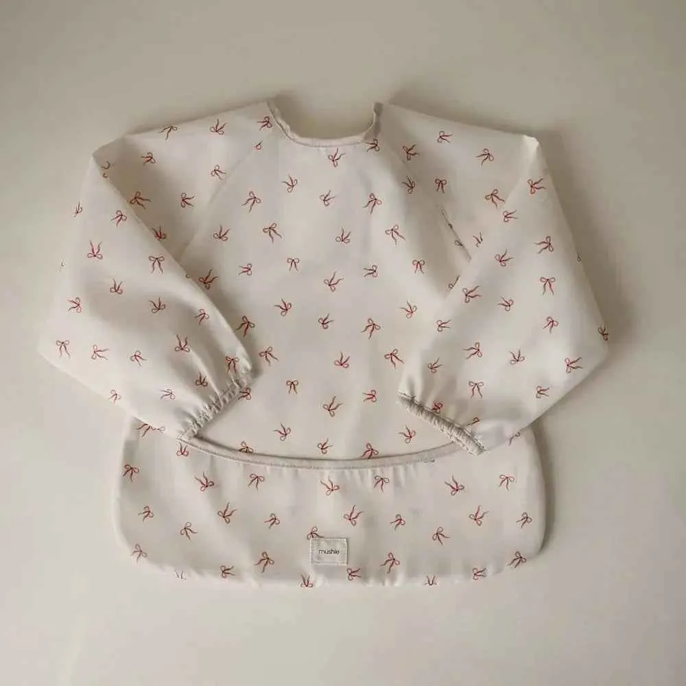 Mushie® Podbradak s rukavima Bows