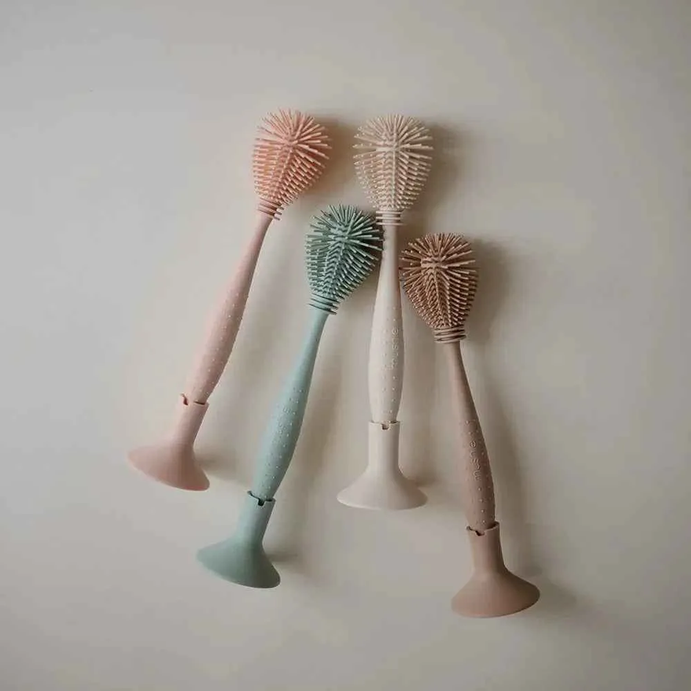 Mushie® Silikonska četka za čišćenje Cambridge Blue