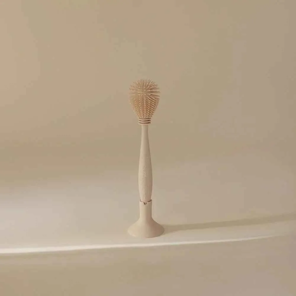 Mushie® Silikonska četka za čiščenje Shifting Sand